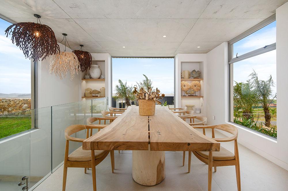 Frameless glass balustrade beside a light-filled living space